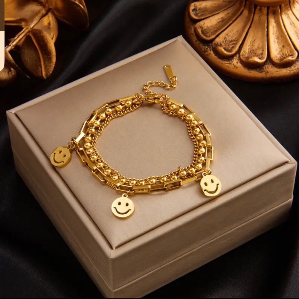 18k gold plated  multi layer smiley 😊 lucky charm bracelet